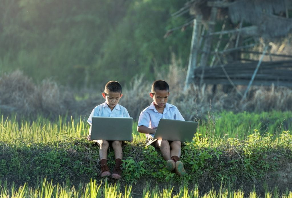 Children engaged in an online class.